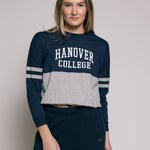 Woman wearing a navy and gray 'Hanover College' outfit on a plain background